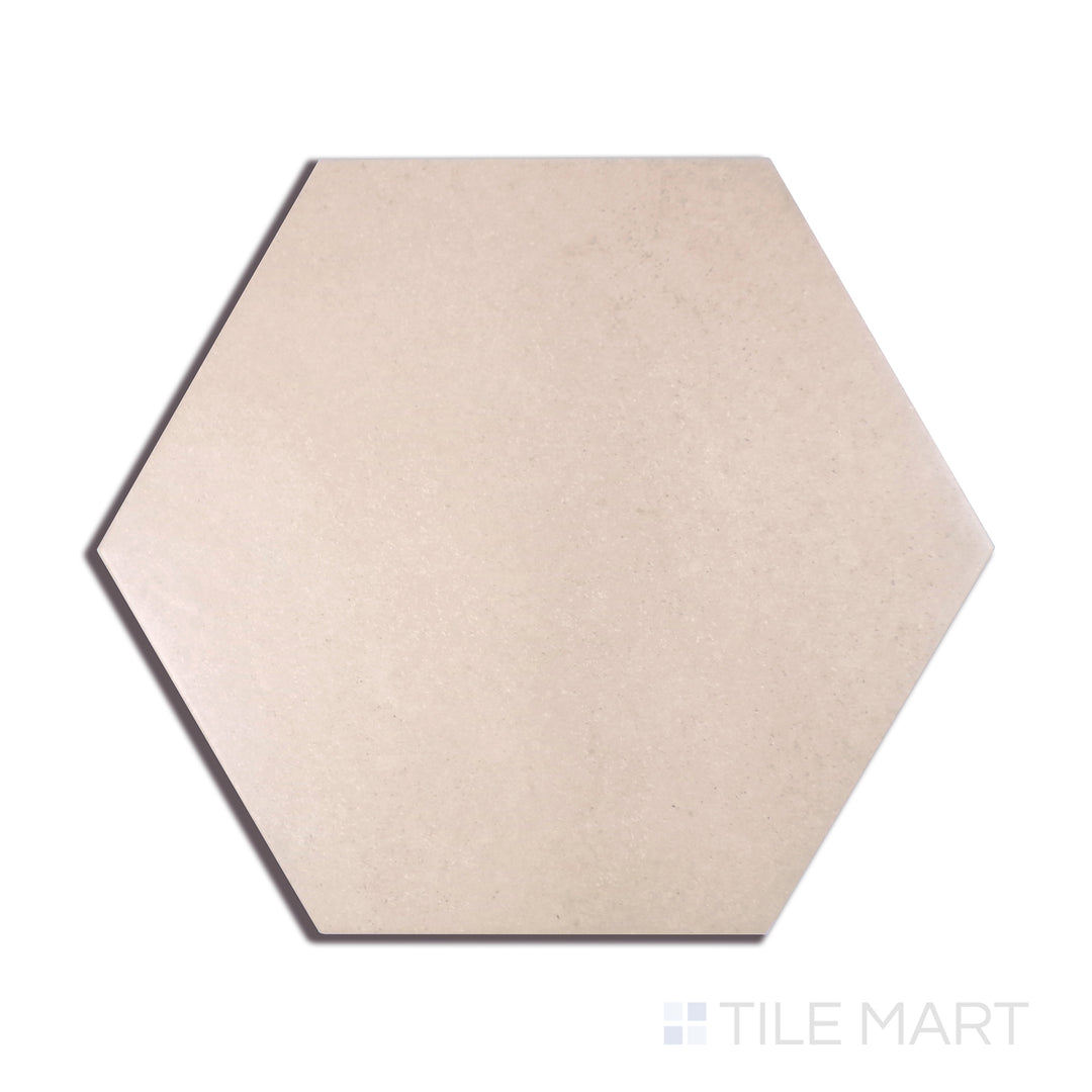 A close-up perspective of Makoto Momoiro Blush 10" Hex Matte Porcelain tile showcases its delicate pink shade and hexagonal format, perfect for soft and inviting interiors.