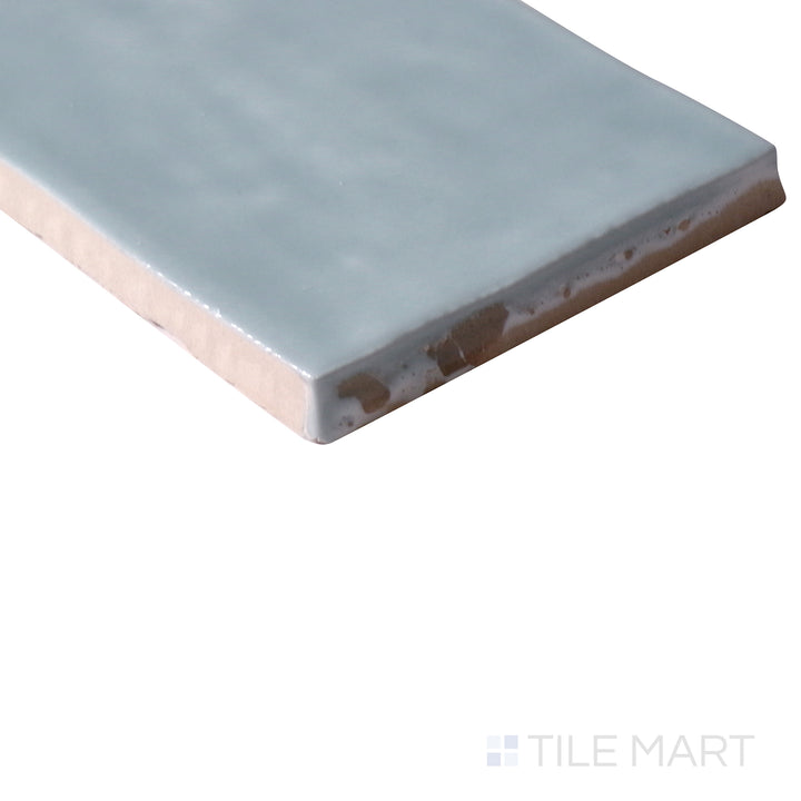 Corner shot of Marin Aloe Green 2.5x5 gloss glazed ceramic tile, displaying a refreshing green hue, sleek glossy finish, and sharp edge alignment at the intersection.