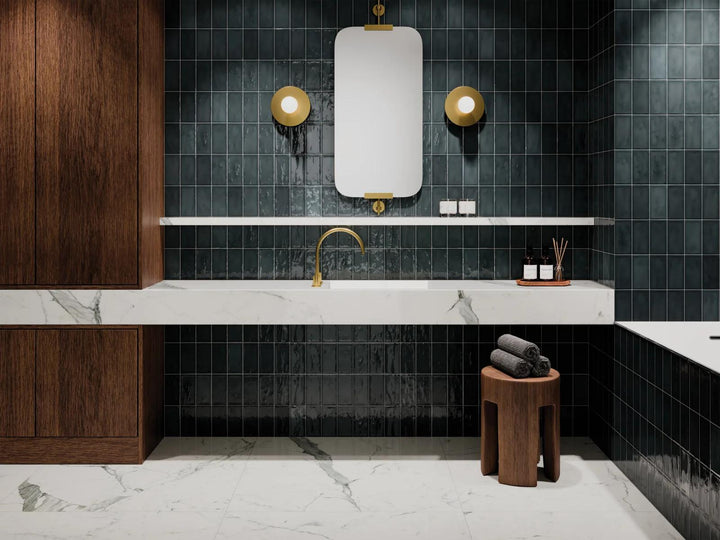 Immerse in the allure of deep ocean hues with Marin Midnight Tide, a 2.5x5 glossy glazed ceramic tile that adds richness and dimension to any design.