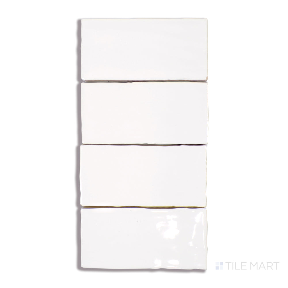 A finely captured close-up of Marin Pearl White 2.5X5 Gloss Glazed Ceramic tile showcases its elegant white hue with a lustrous gloss, creating a refined and timeless appeal.