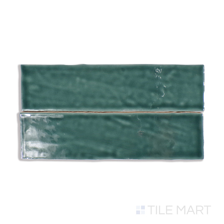 A refined close-up of Marin Ocean Teal 2.5X10 Gloss Glazed Ceramic tile brings out its rich teal color and reflective surface, adding a refreshing aquatic charm.