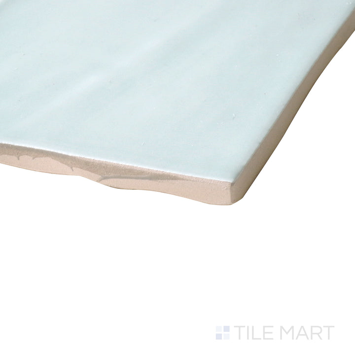 Corner shot of Marin Aloe Green 4x4 gloss glazed ceramic tile, displaying a fresh green tone, highly reflective surface, and precise edge transition.