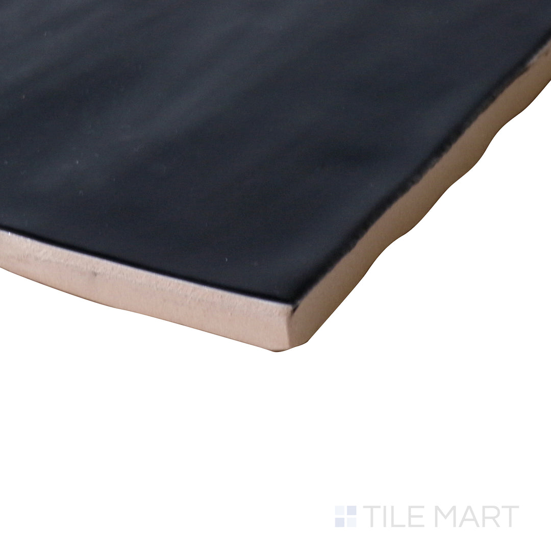 Corner shot of Marin Black Sea 4x4 gloss glazed ceramic tile, featuring a deep black shade, high-gloss reflective finish, and seamless edge alignment at the intersection.