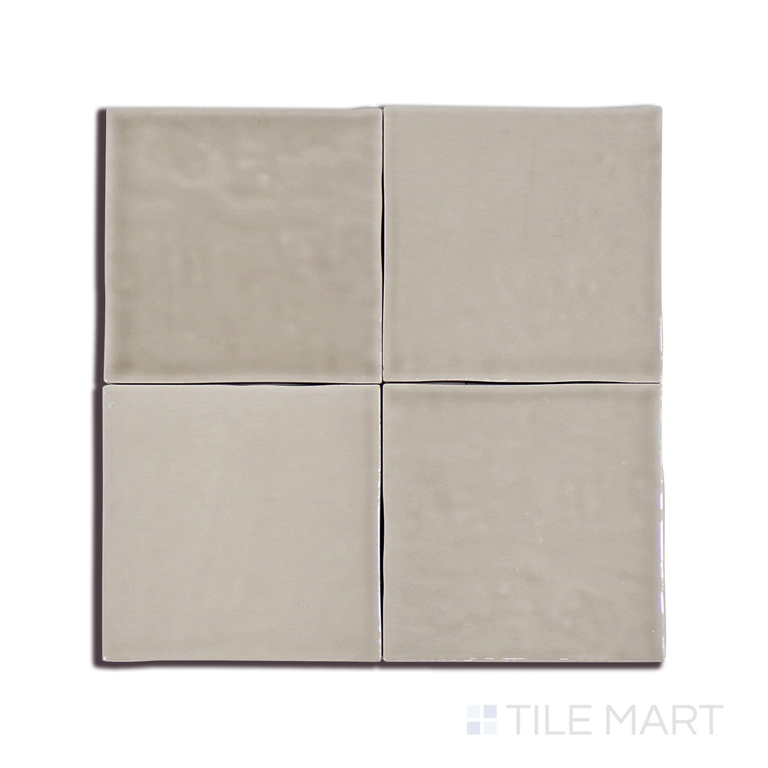 A crisp close-up of Marin Coastal Cliff 4X4 Gloss Glazed Ceramic tile accentuates its warm neutral shade and sleek glaze, seamlessly complementing modern interiors.