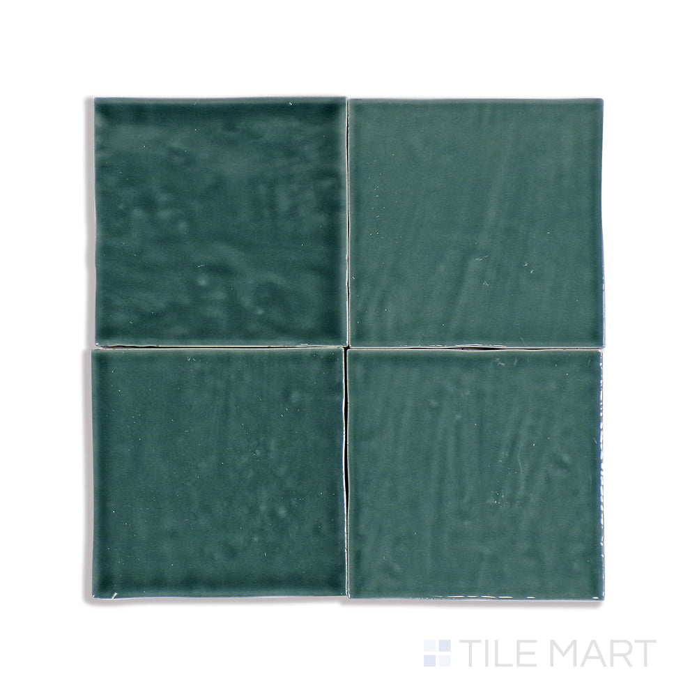 A finely captured close-up of Marin Ocean Teal 4X4 Gloss Glazed Ceramic tile highlights its vivid teal shade and high-gloss surface, exuding coastal charm and freshness.