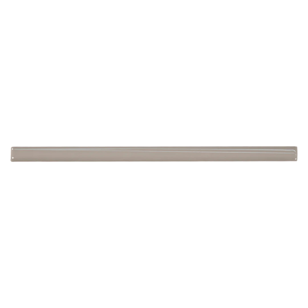 Overhead visualization of the Marin Coastal Cliff 0.5X12 Gloss Glazed Ceramic Jolly trim showcases a soft gray shade with a glossy surface, enhancing any refined aesthetic.