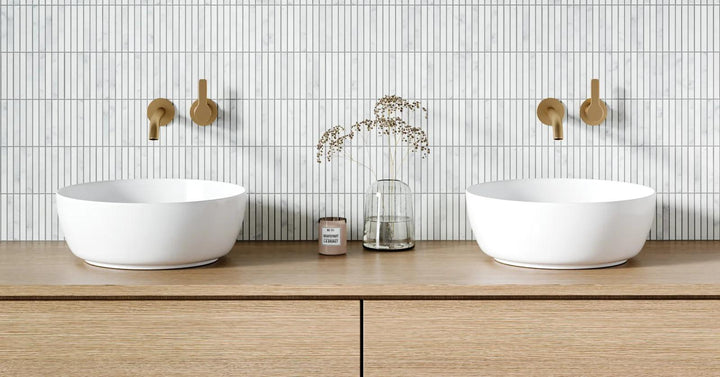 A luxurious atmosphere crafted with Monet White Carrara Honed Marble Mosaic, adding depth and sophistication through its natural stone texture.