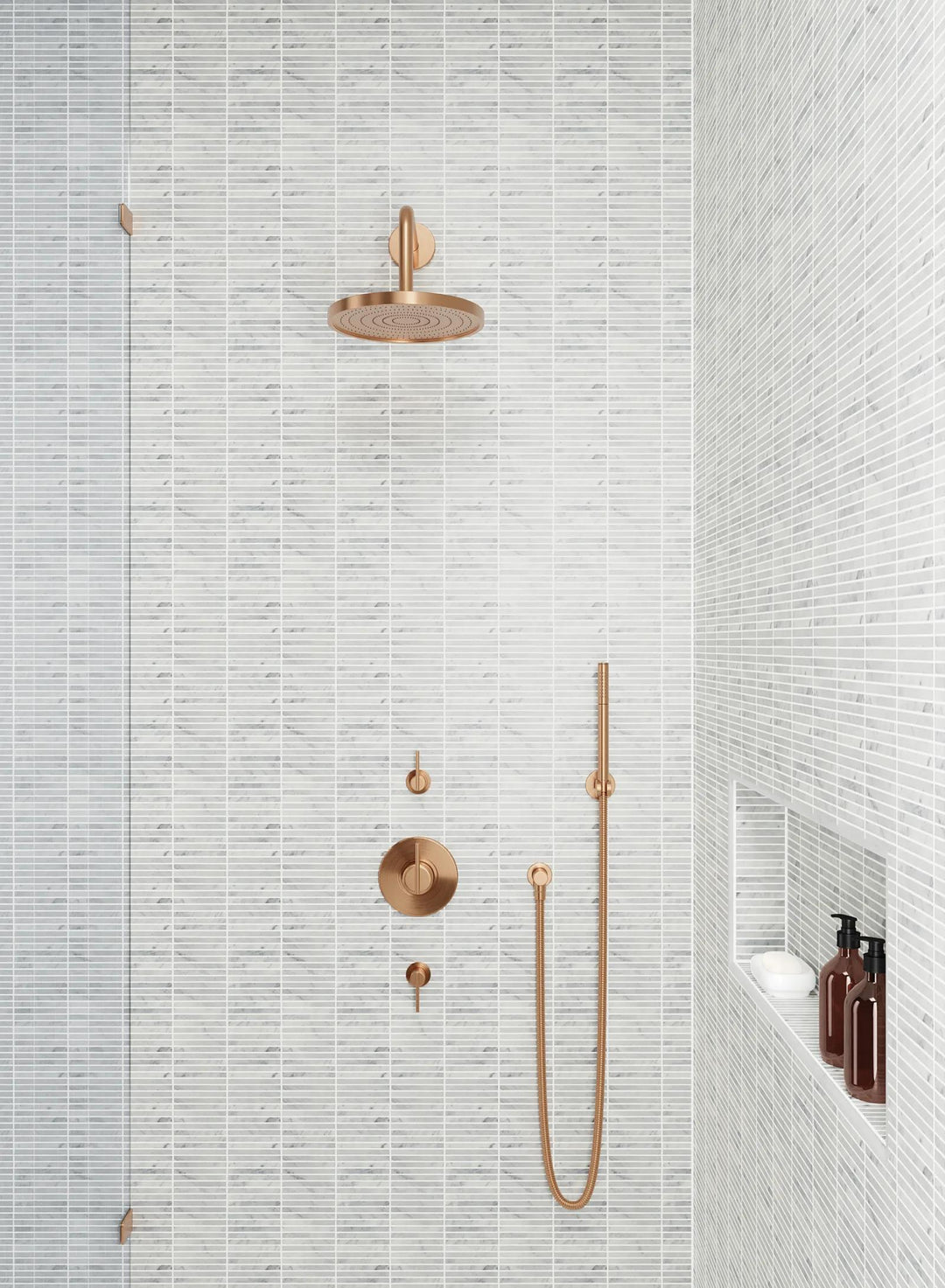 A sophisticated honed marble mosaic, Monet White Carrara Mosaic 3 showcases refined white tones with delicate veining.