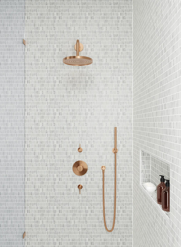 A natural honed marble mosaic, Monet White Carrara Mosaic 7 highlights the beauty of white stone with intricate veining.