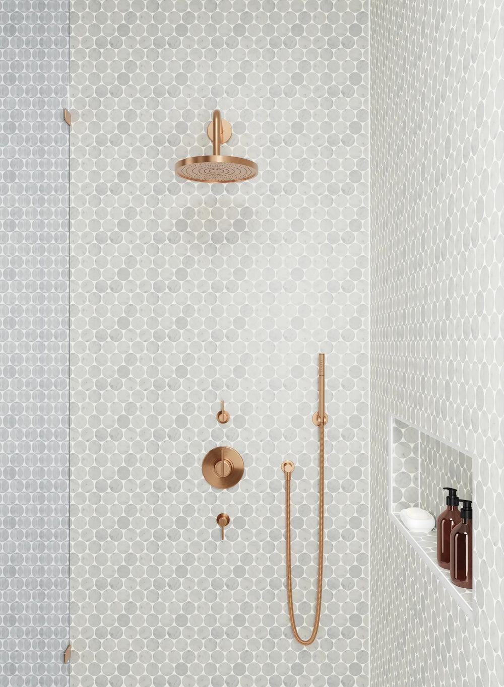 The natural beauty of Monet White Carrara honed marble mosaic enhances any design with its smooth finish and gracefully flowing veins.