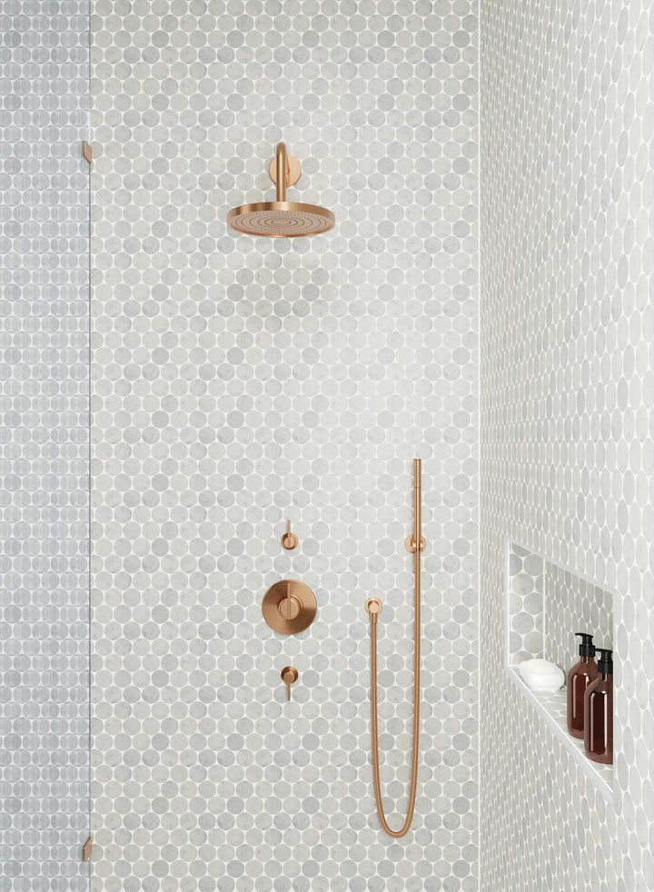 The natural beauty of Monet White Carrara honed marble mosaic enhances any design with its smooth finish and gracefully flowing veins.