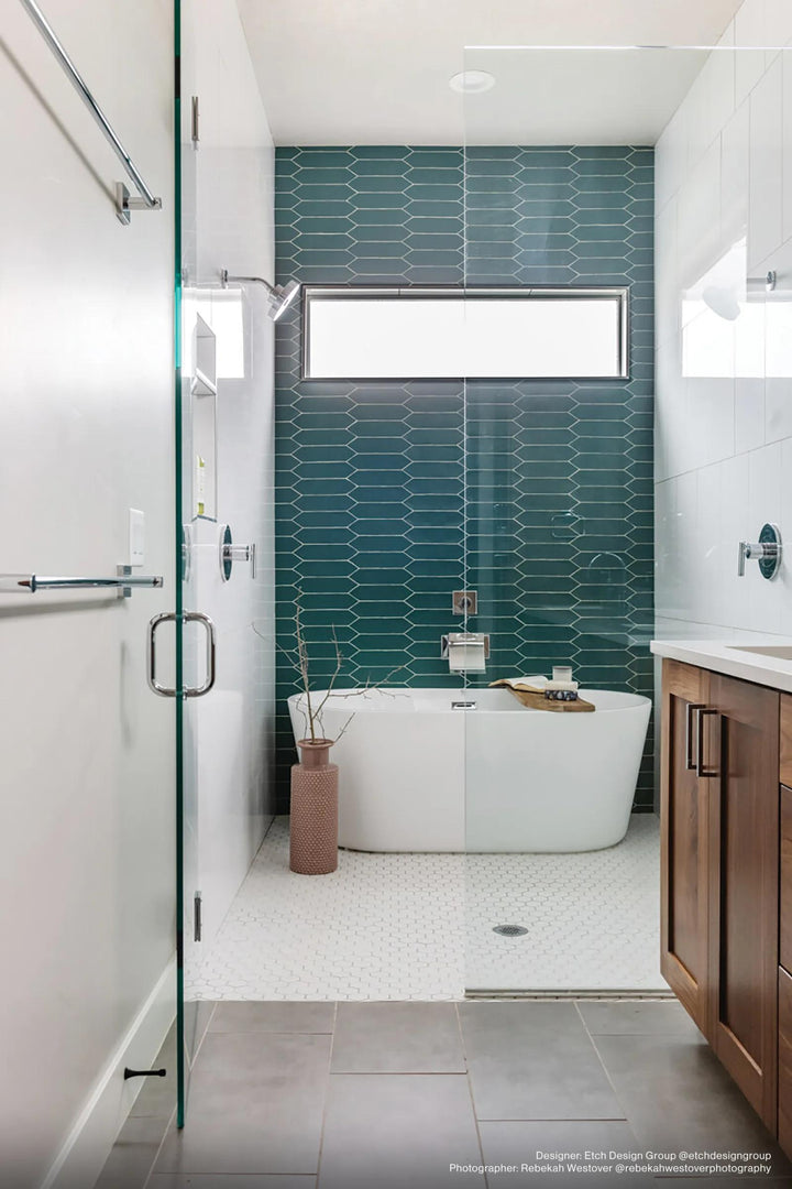 A deep and bold ambiance featuring Reine Dark Teal 3X12 Matte Glazed Ceramic, where its matte finish brings a rich and contemporary touch.