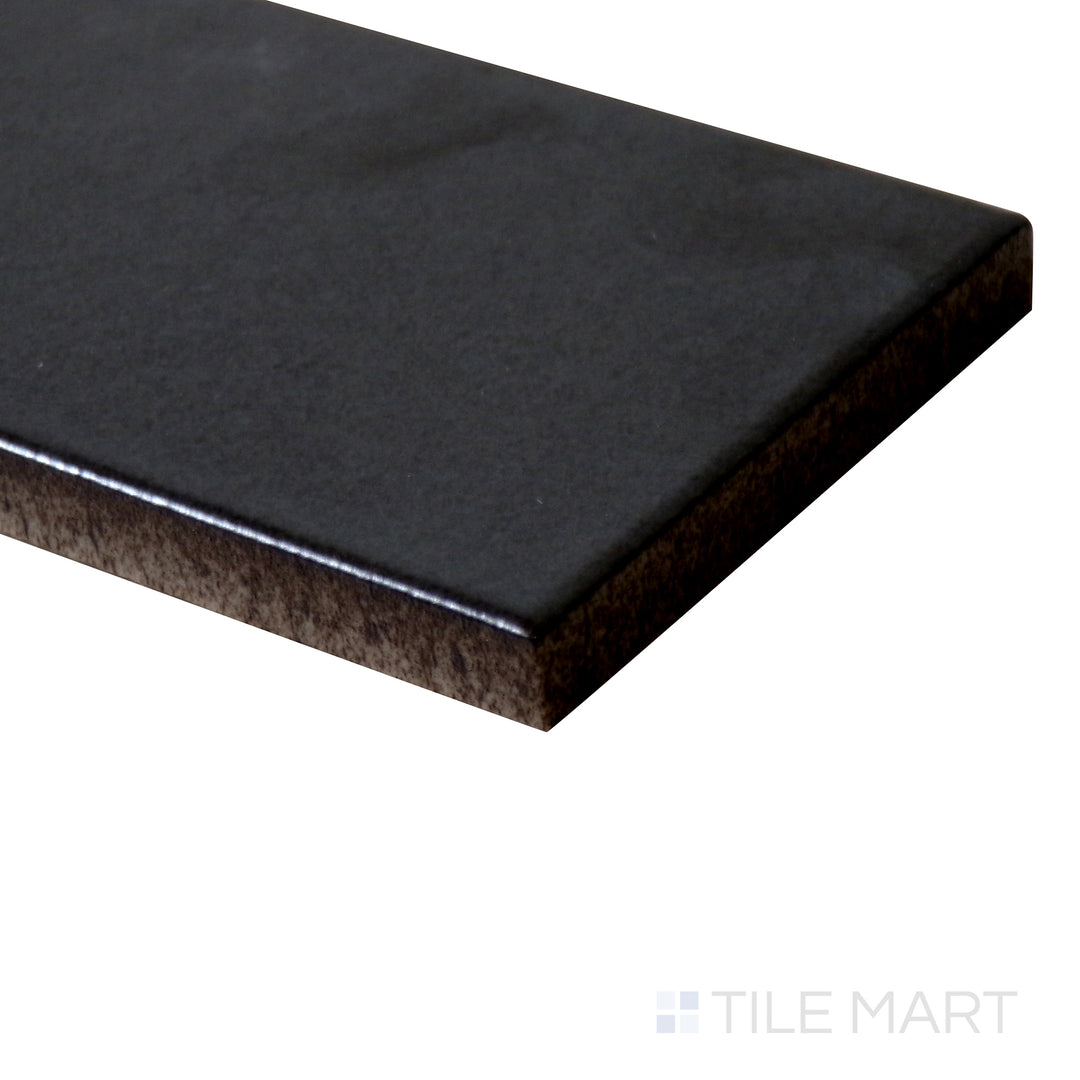 Side-angle close-up of Zenia Gravity 2.5x9 matte glazed porcelain tile, highlighting its neutral earthy tone, velvety matte texture, and precisely structured edge alignment.