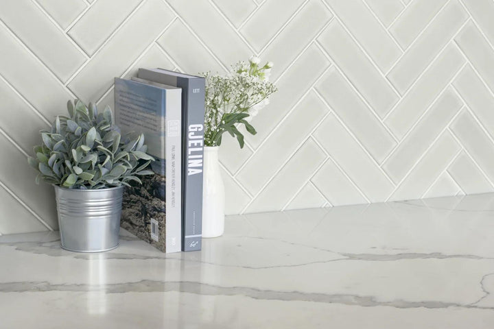 Zenia Moon 2.5x9 matte glazed porcelain showcases a soft gray hue with a muted finish, offering a realistic, understated look that blends effortlessly into various designs.