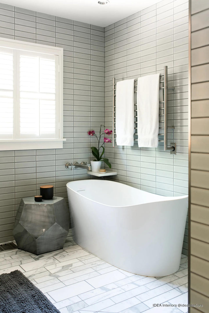 A soft, muted blue matte finish introduces a celestial-inspired charm, bringing subtle depth and movement with Zenia Moon 2.5x9 matte glazed porcelain.