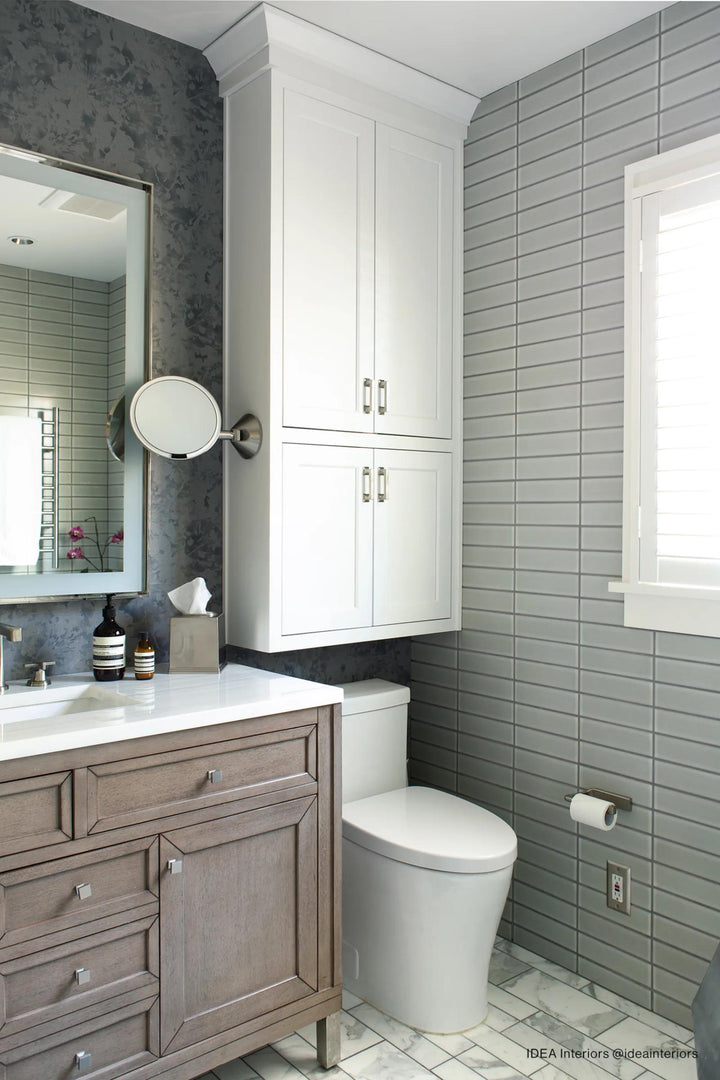 Soft, muted tones create an inviting atmosphere, paired elegantly with Zenia Moon 2.5X9 Matte Glazed Porcelain.