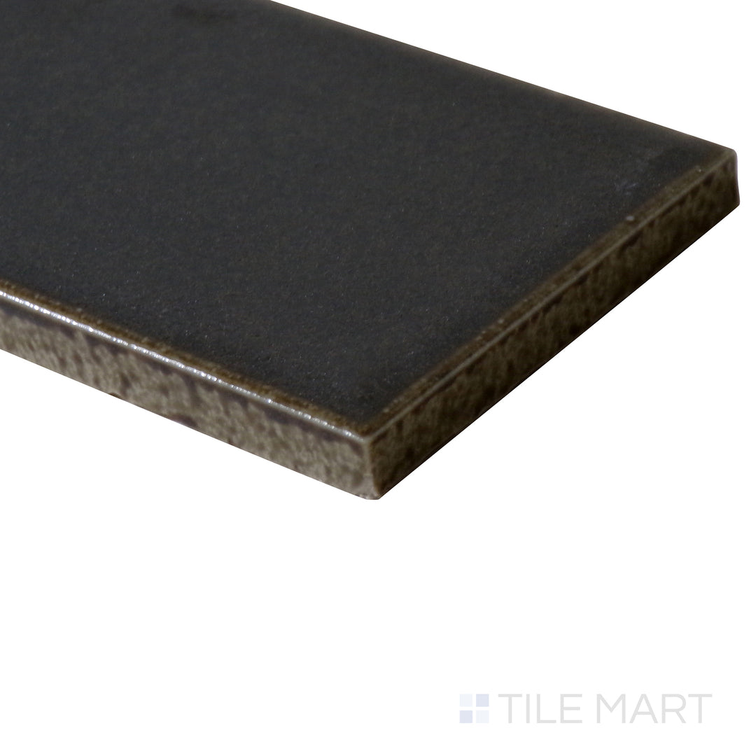 Angled close-up of Zenia Orbit 2.5x9 matte glazed porcelain tile, featuring a deep cosmic blue hue, refined matte finish, and precisely cut edges forming a structured junction.