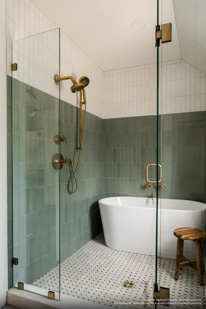 A refined gray matte surface with delicate variations provides a sophisticated, understated backdrop, perfectly styled with Zenia Orion 2.5x9 matte glazed porcelain.