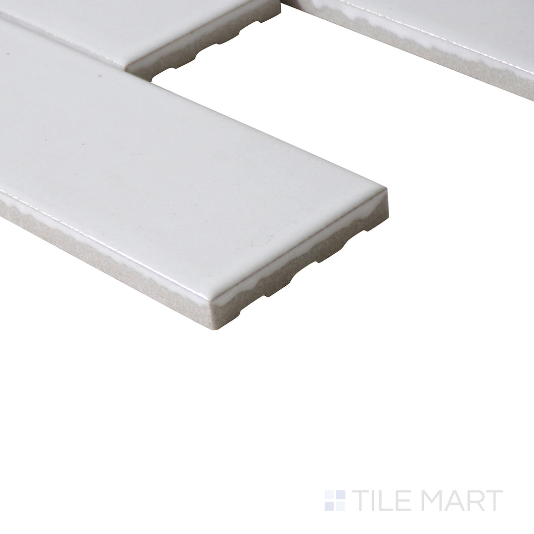 Corner shot of Zenia Milky Way rectangle gloss glazed porcelain mosaic, featuring a pure white glaze, reflective finish, and smooth edge alignment.