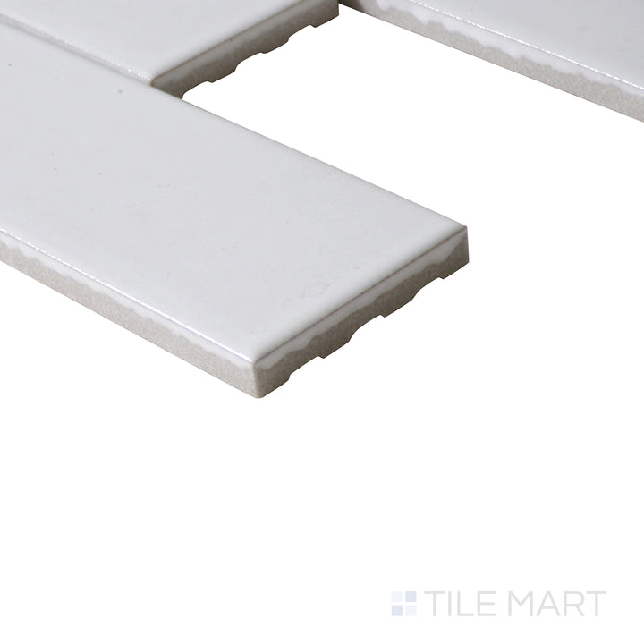 Corner shot of Zenia Milky Way rectangle gloss glazed porcelain mosaic, featuring a pure white glaze, reflective finish, and smooth edge alignment.