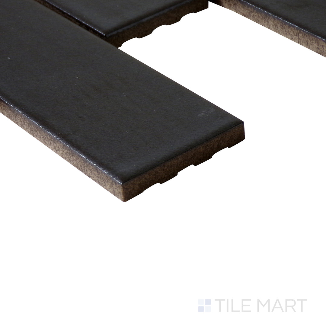 Side-angle close-up of Zenia Gravity rectangle matte glazed porcelain mosaic, highlighting its neutral grey hue, non-reflective matte finish, and finely cut edge details.