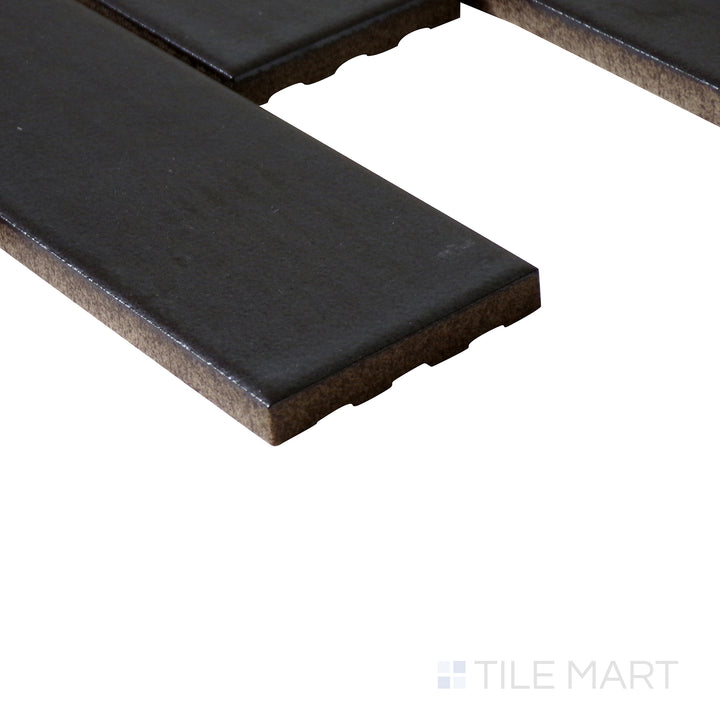 Side-angle close-up of Zenia Gravity rectangle matte glazed porcelain mosaic, highlighting its neutral grey hue, non-reflective matte finish, and finely cut edge details.