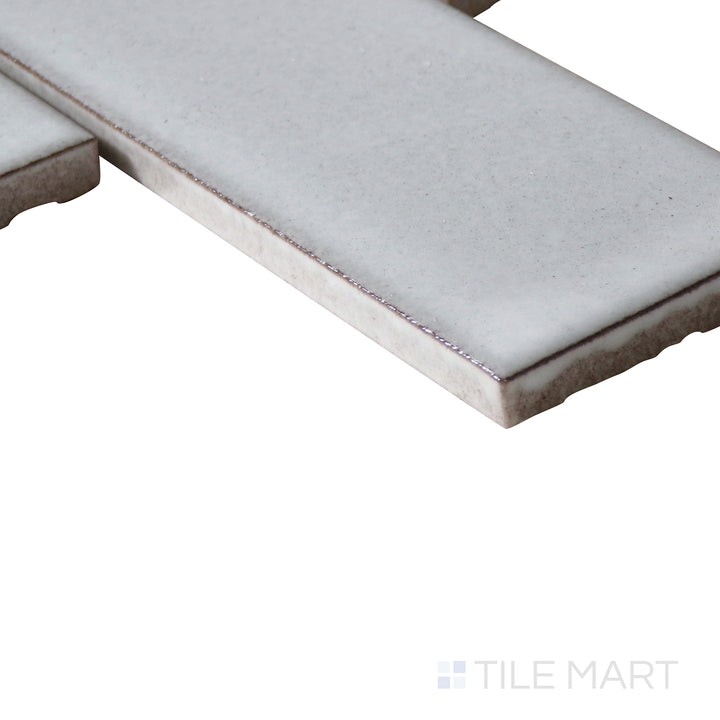 Corner-focused image of Zenia Moon rectangle matte glazed porcelain mosaic, drawing attention to its soft grey tone, smooth matte surface, and crisp edge transition.