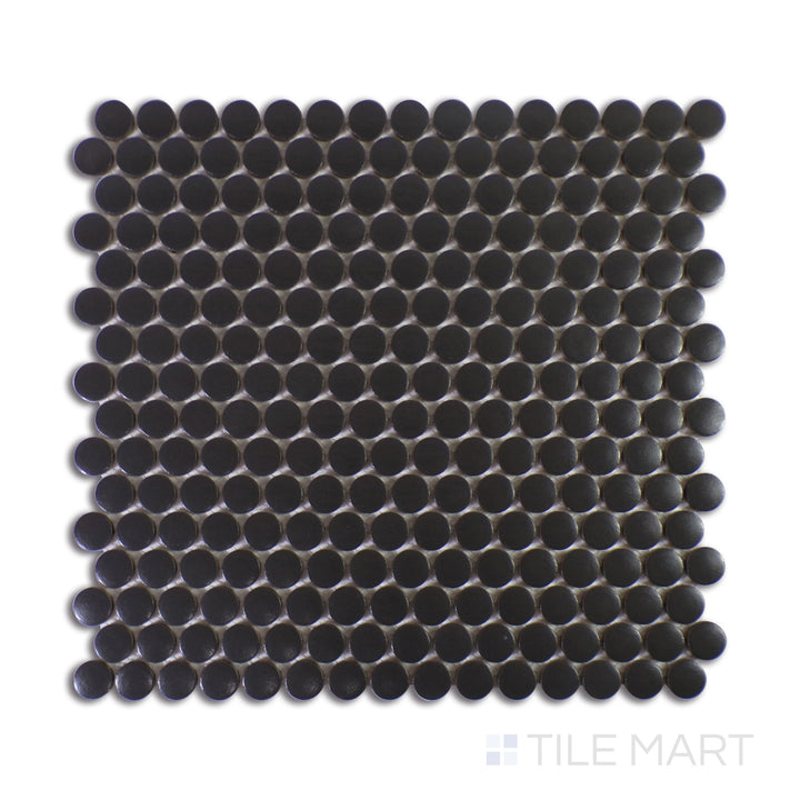 A finely detailed close-up of Marin Midnight Tide 3/4" Penny Round Matte Glazed Porcelain Mosaic reveals its deep navy blue tones and matte texture, bringing a bold, oceanic feel.