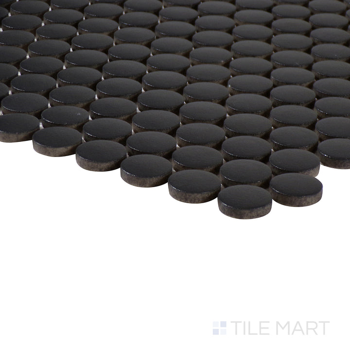Corner-focused image of Marin Midnight Tide 3/4" penny round matte glazed porcelain mosaic, emphasizing its deep navy tone, fine matte surface, and the structured transition at the corner.