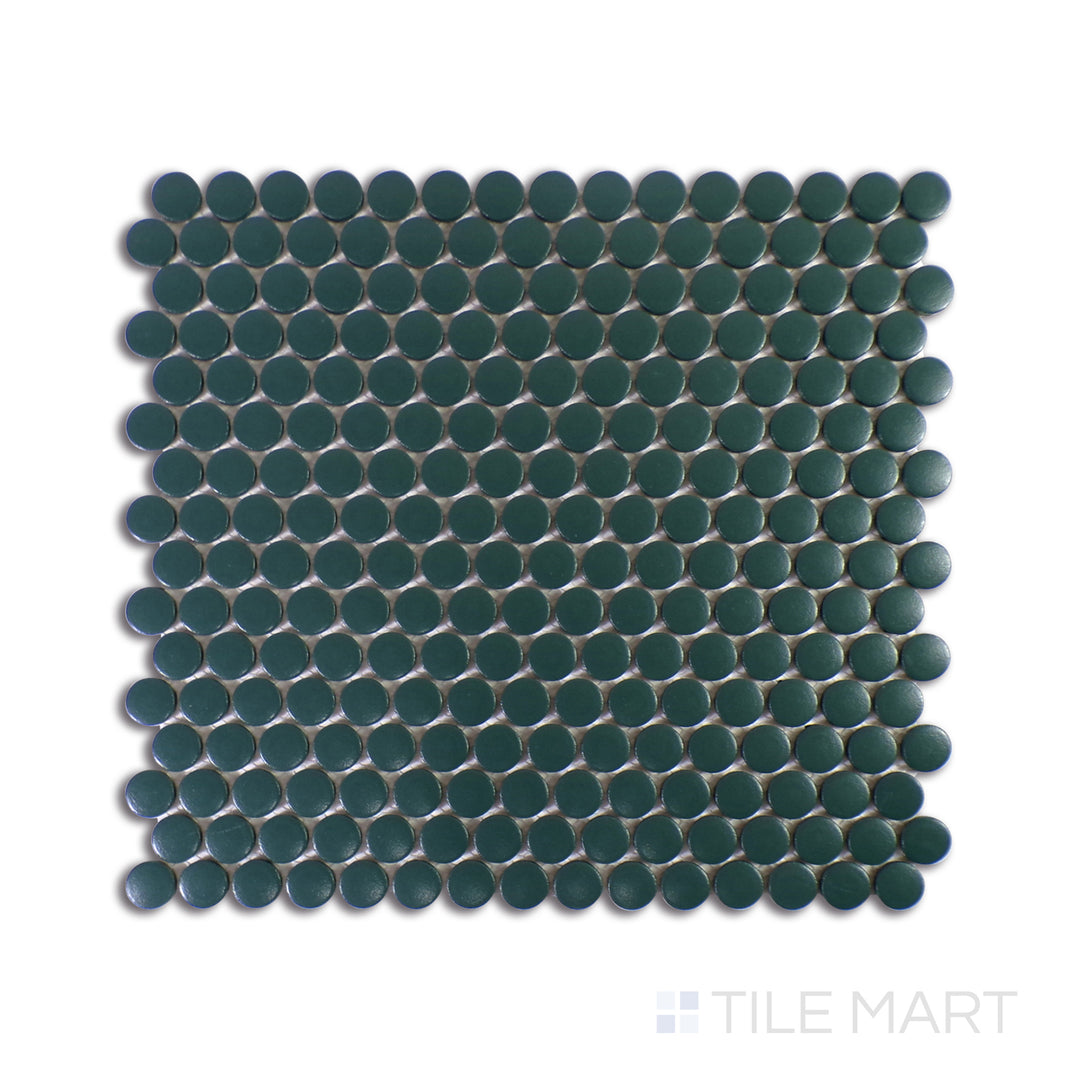 A sharp close-up of Marin Ocean Teal 3/4" Penny Round Matte Glazed Porcelain Mosaic showcases its rich teal shades and refined matte finish, adding a bold yet soothing touch.