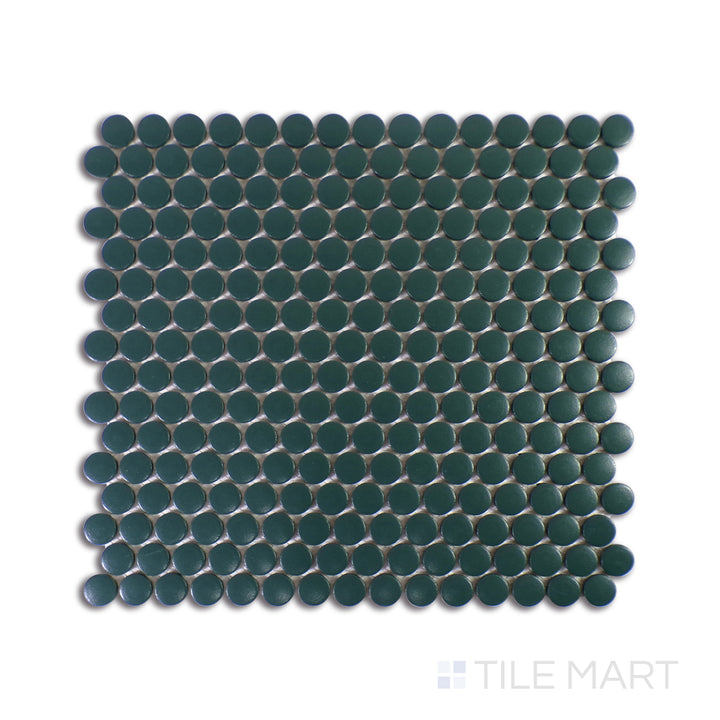 A sharp close-up of Marin Ocean Teal 3/4" Penny Round Matte Glazed Porcelain Mosaic showcases its rich teal shades and refined matte finish, adding a bold yet soothing touch.