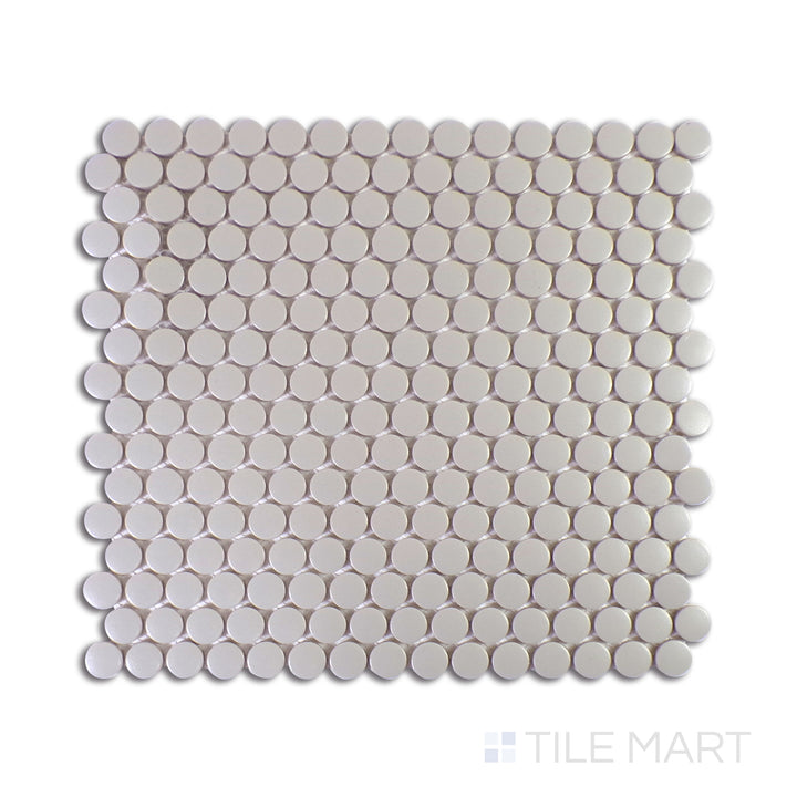 An ultra-close shot of Marin Pebble Gray 3/4" Penny Round Matte Glazed Porcelain Mosaic showcases its neutral gray tones with a sleek matte surface, offering timeless versatility.