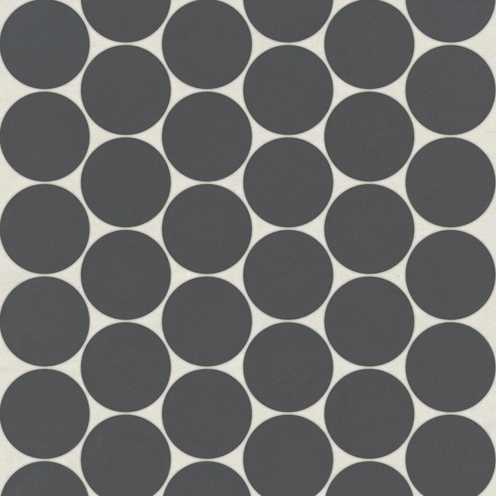 Top-down view of Marin Black Sea 2" Penny Round Matte Glazed Porcelain Mosaic, showcasing deep black hues with a modern matte glaze in a classic penny round layout.