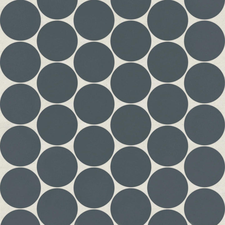 Flat lay of Marin Midnight Tide 2" Penny Round Matte Glazed Porcelain Mosaic, presenting rich navy blue shades in a bold matte glaze for a striking effect.