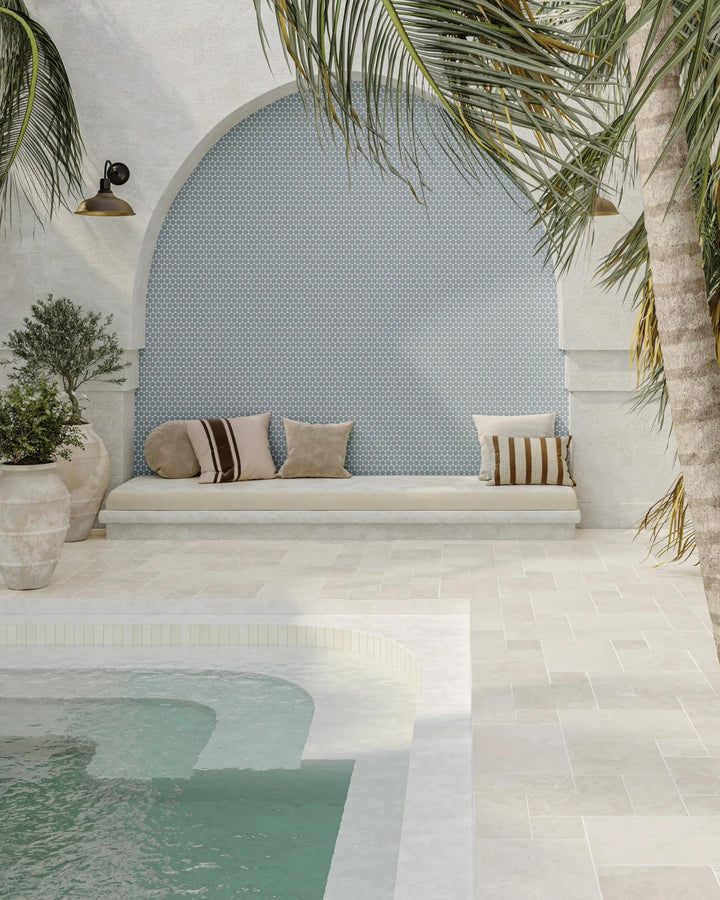 A soft, misty blue tone and circular elegance define Marin Misty Blue 2" penny round matte glazed porcelain, adding a gentle, refreshing ambiance.