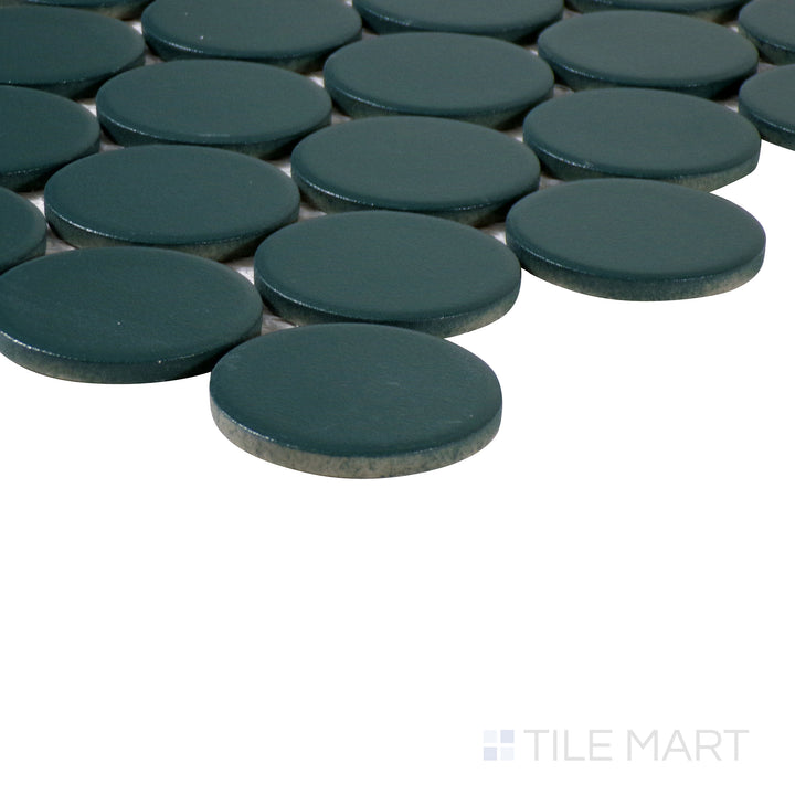 Corner shot of Marin Ocean Teal 2" penny round matte glazed porcelain mosaic, displaying its rich teal color, fine matte texture, and the precise alignment of penny tiles.