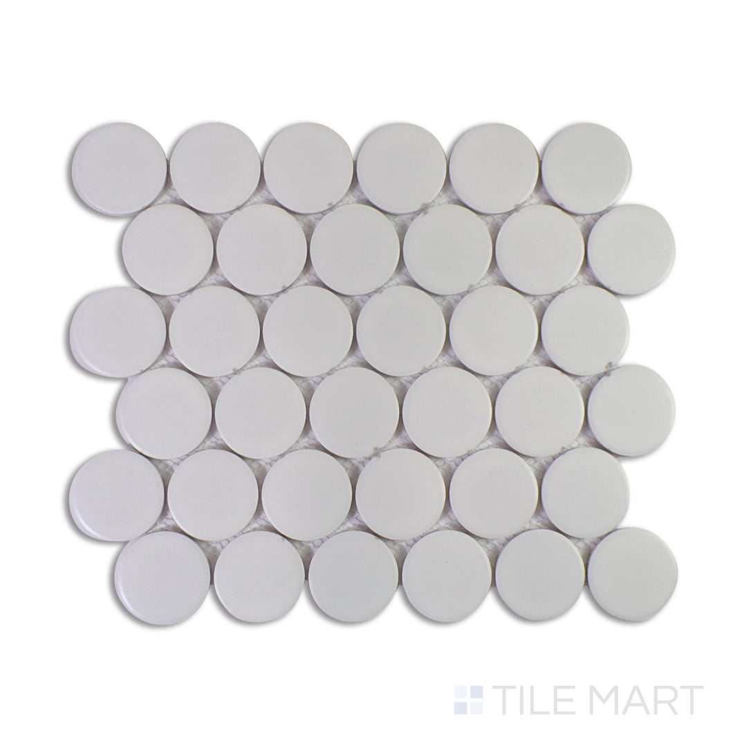 A macro shot of Marin Pearl White 2" Penny Round Matte Glazed Porcelain Mosaic captures its crisp white tones with a soft matte finish, perfect for bright and airy interiors.