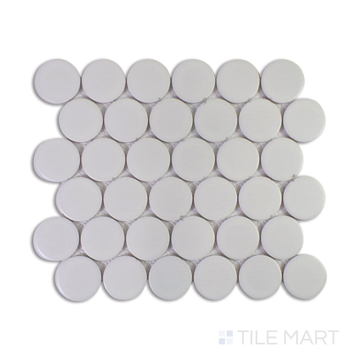 A macro shot of Marin Pearl White 2" Penny Round Matte Glazed Porcelain Mosaic captures its crisp white tones with a soft matte finish, perfect for bright and airy interiors.