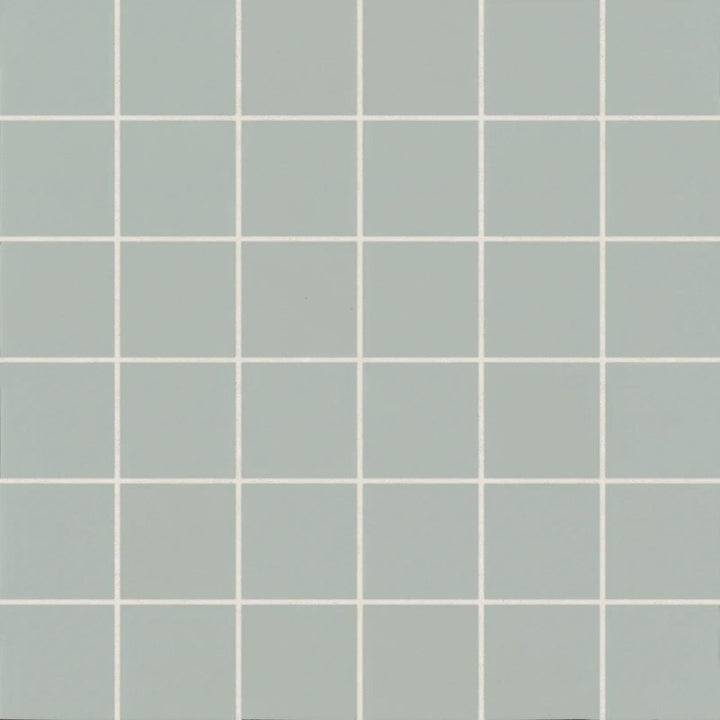 Top-down view of Marin Aloe Green 2" Square Matte Glazed Porcelain Mosaic, featuring a fresh green hue in a structured square layout with a soft matte finish.