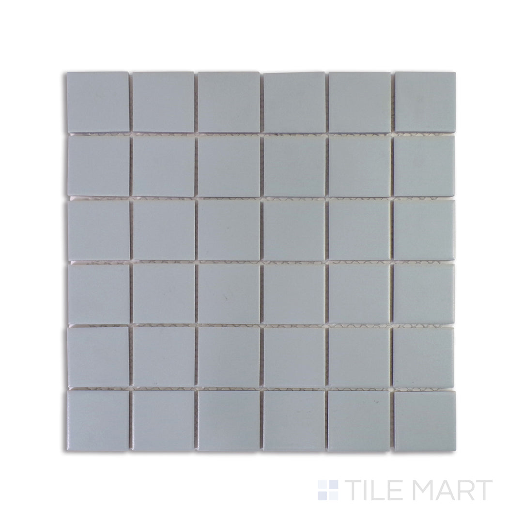 A zoomed-in shot of Marin Aloe Green 2" Square Matte Glazed Porcelain Mosaic highlights its earthy green tones and sleek matte glaze, perfect for refreshing interiors.