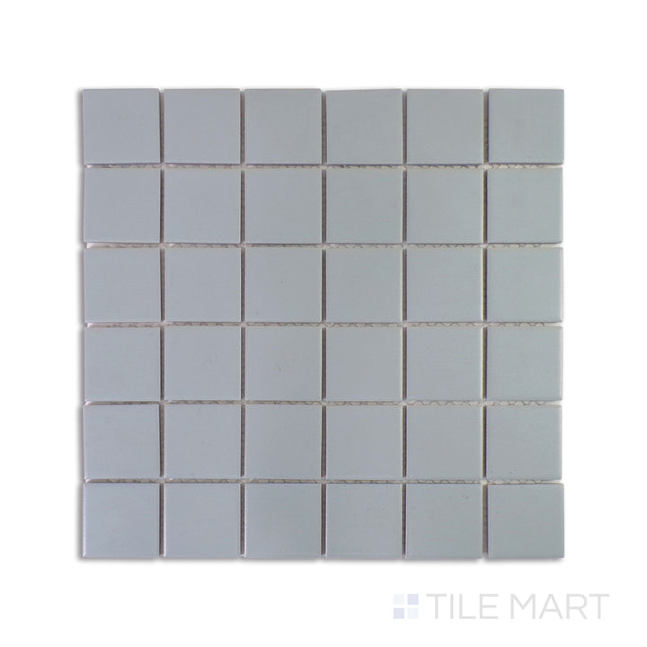 A zoomed-in shot of Marin Aloe Green 2" Square Matte Glazed Porcelain Mosaic highlights its earthy green tones and sleek matte glaze, perfect for refreshing interiors.