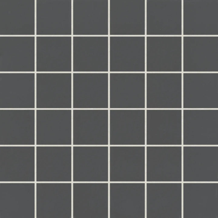 Overhead shot of Marin Black Sea 2" Square Matte Glazed Porcelain Mosaic, presenting deep black tones with a modern matte glaze in a geometric square design.