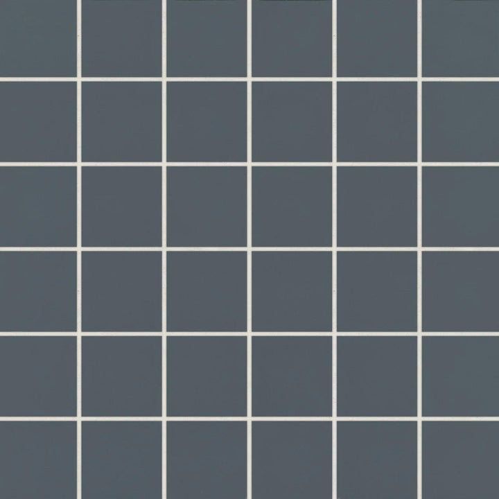 Aerial view of Marin Midnight Tide 2" Square Matte Glazed Porcelain Mosaic, emphasizing dark blue tones in a square grid layout with a contemporary matte finish.