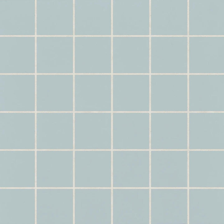 Top-down perspective of Marin Misty Blue 2" Square Matte Glazed Porcelain Mosaic, displaying cool blue shades with a calming matte glaze.