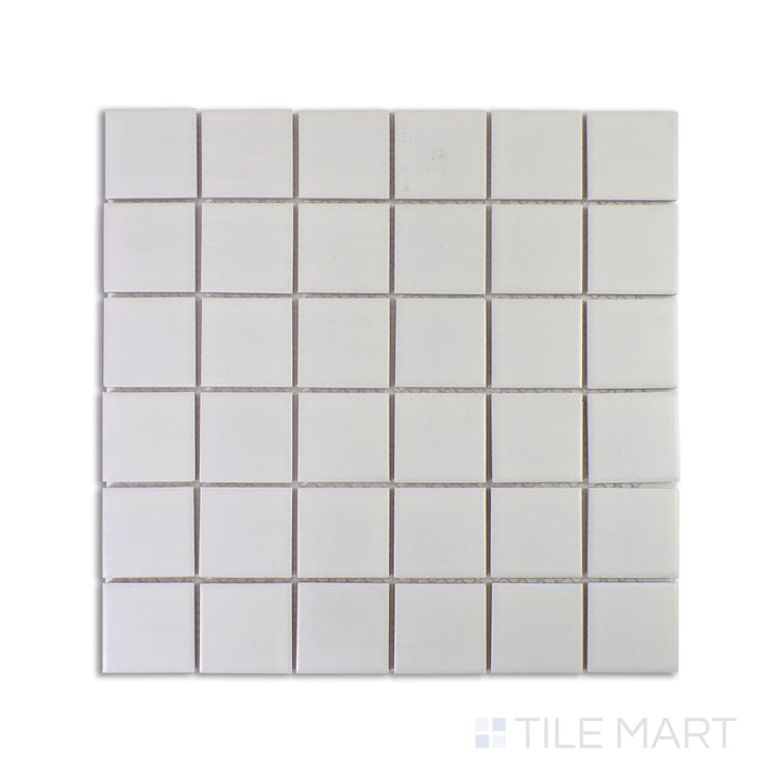 A macro perspective of Marin Pearl White 2" Square Matte Glazed Porcelain Mosaic captures its bright white hue with a soft matte glaze, enhancing spaces with a clean, fresh look.