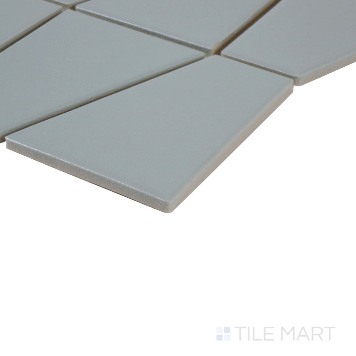 Corner shot of Marin Aloe Green trapezoid matte glazed porcelain mosaic, featuring a vibrant green shade, structured matte surface, and crisp edge transition.