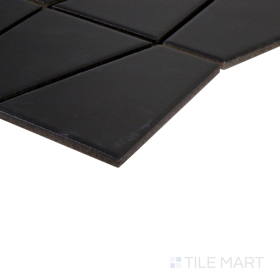 Angled perspective of Marin Black Sea trapezoid matte glazed porcelain mosaic, showcasing its deep black hue, soft matte texture, and how the edges meet at a precise angle.