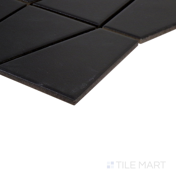 Angled perspective of Marin Black Sea trapezoid matte glazed porcelain mosaic, showcasing its deep black hue, soft matte texture, and how the edges meet at a precise angle.