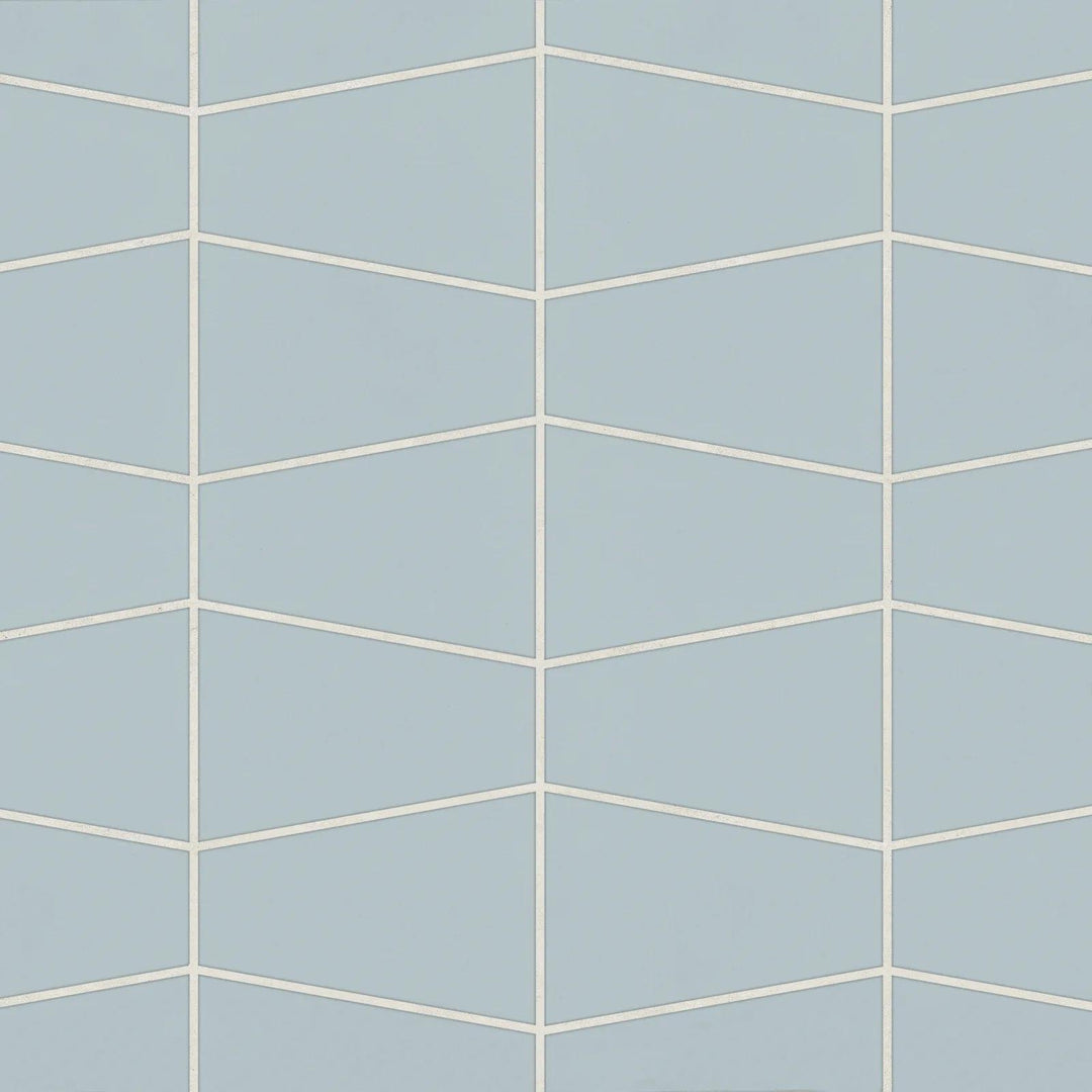 Overhead image of Marin Misty Blue Trapezoid Matte Glazed Porcelain Mosaic, emphasizing soft blue shades in a modern trapezoid layout with a sleek matte glaze.