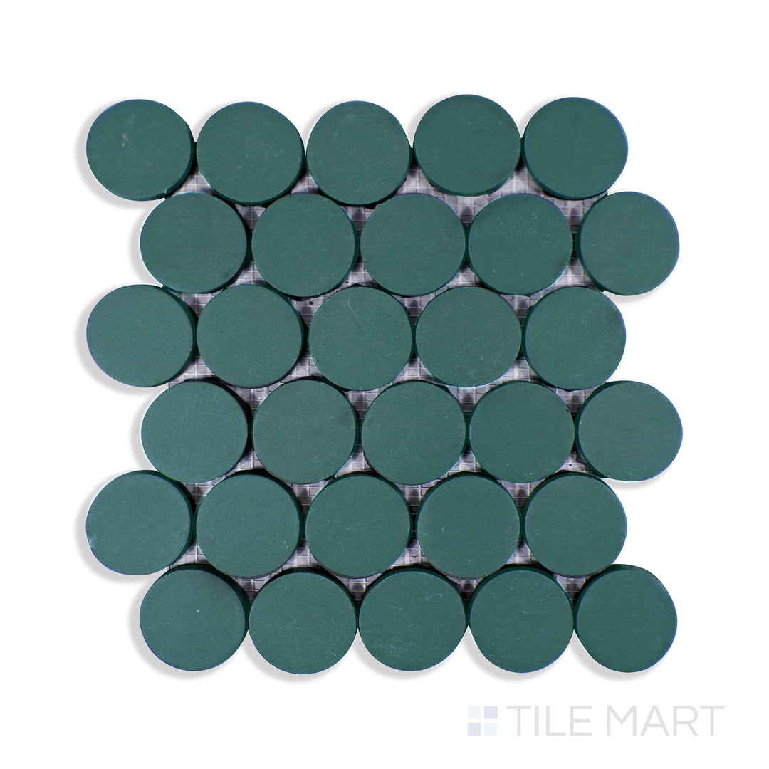 An intricate close-up of Makoto Midori Green 2" Round Matte Porcelain Mosaic reveals its rich green shade and smooth matte surface, bringing organic depth to contemporary spaces.